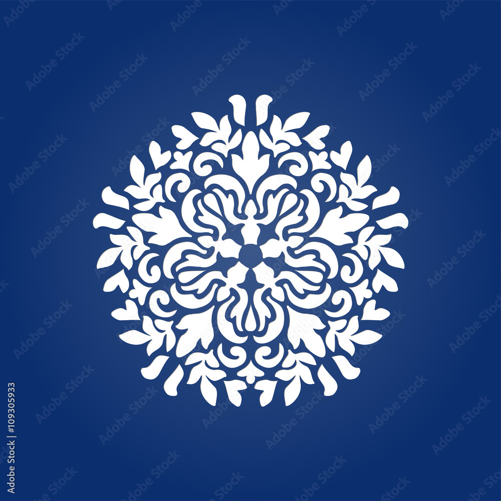 Die cut paper card with cutout mandala ornament. 