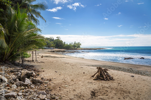 Fototapeta Naklejka Na Ścianę i Meble -  Beautiful blue sky day with a blue sea and empty sand. Playa Samara, Costa Rica, Central America.