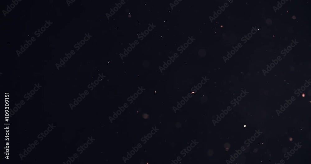 orange particles like spark slowly float in air, 4k prores