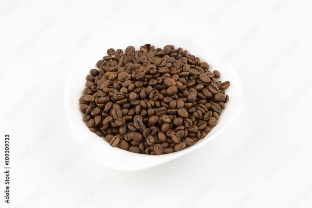 white plate full of coffee beans white plate full of coffee beans