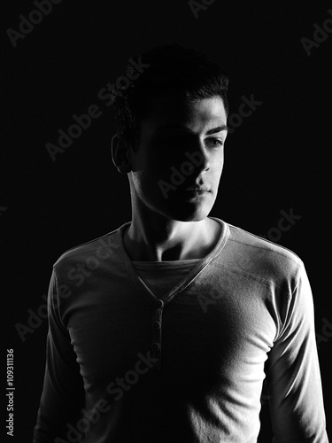 stylish young man portrait in low-key
