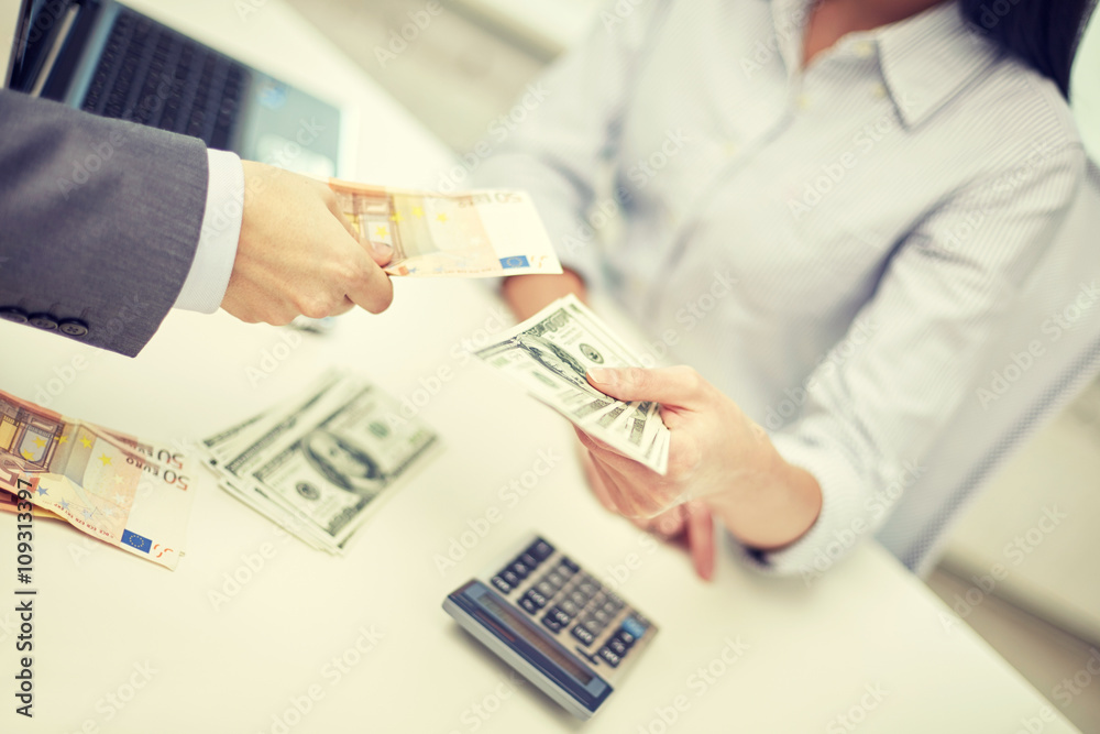 close up of hands giving or exchanging money close up of hands giving or exchanging money