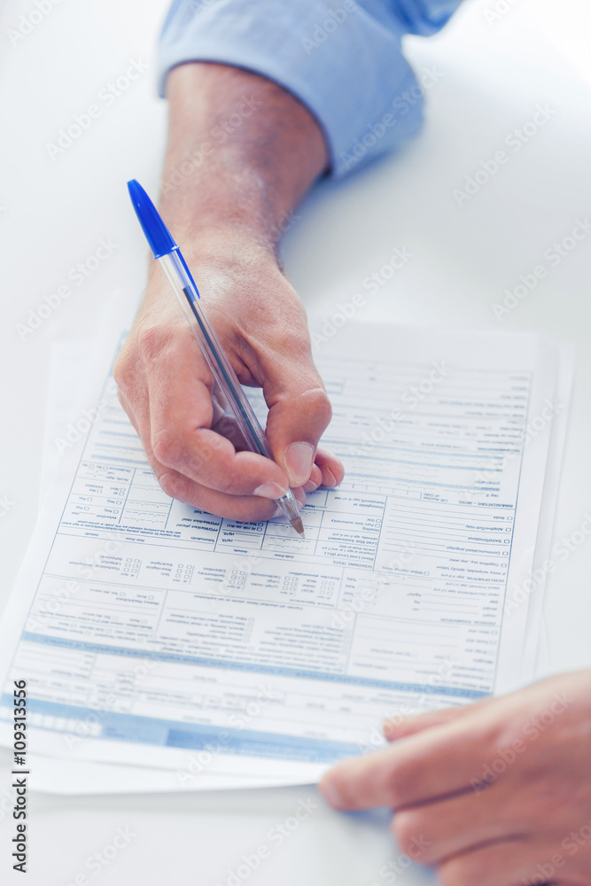 Naklejka premium man signing a contract
