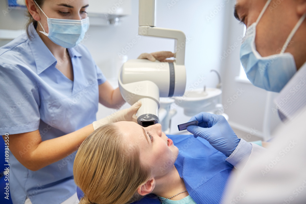 dentists and patient with dental x-ray machine dentists and patient with dental x-ray machine
