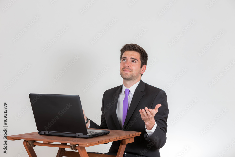 Business man seems to have issues on his laptop Business man seems to have issues on his laptop