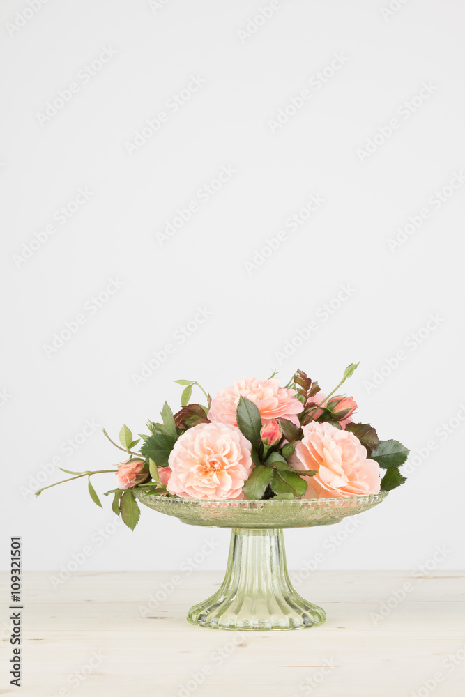 Naklejka premium Rose arrangement with copy space, in vertical format.