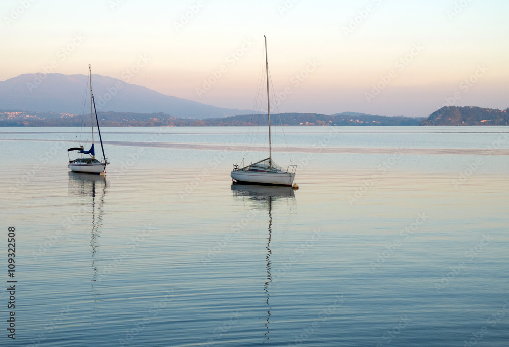 Sailboats in lake Maggiore (Italy) - sunset Sailboats in lake Maggiore (Italy) - sunset