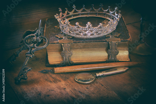 queen crown on old book. fantasy middle age concept