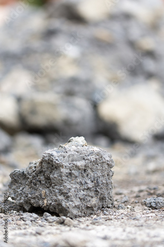 Concrete rocks shallow depth selective focus © zlajaphoto