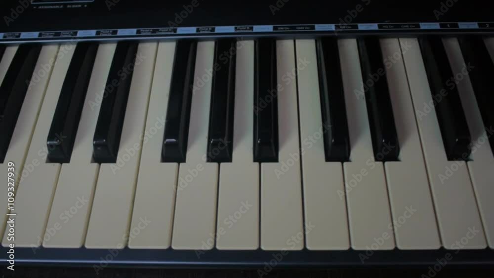 Man Playing the synthesizer keyboard in sound studio. Man Playing the synthesizer keyboard in sound studio.