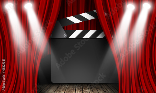 Movie clapperboard on a red