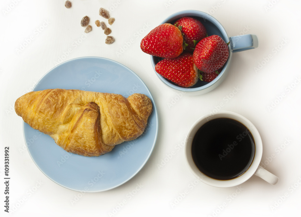 Breakfast photo: coffee, croissant and strawberries on white