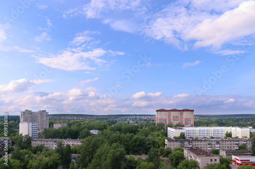 Panoramic view of residential buildings among trees and countrys