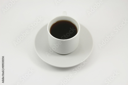 Cup of black tea on white background