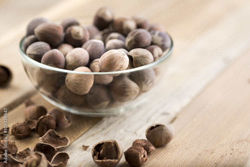 Close-up of hazelnuts on wooden table. Close-up of hazelnuts on wooden table.