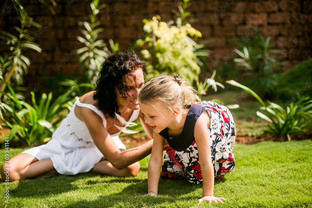 mother and preteen daughter summer portrait in the green beautiful park mother and preteen daughter summer portrait in the green beautiful park