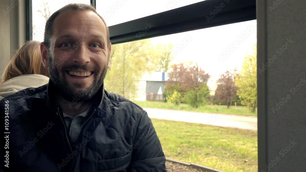 Portrait of happy, young man during tram ride in city, super slow motion 240fps
Portrait of happy, young man during tram ride in city, super slow motion 240fps
