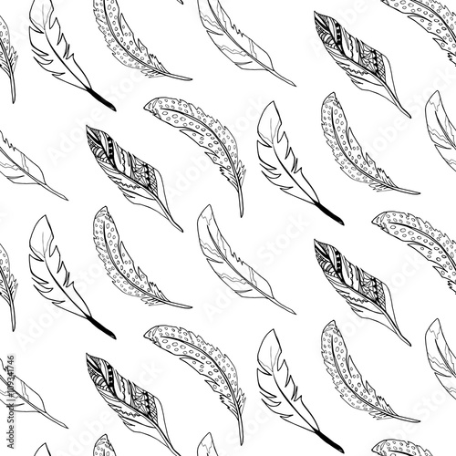 Seamless pattern made with boho style drawn feathers. Vector image
