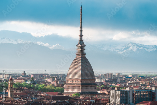 Cityscape of Torino (Turin, Italy) at sunset with storm clouds