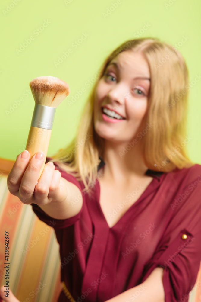 Attractive woman holding powder brush. Make up. Attractive woman holding powder brush. Make up.