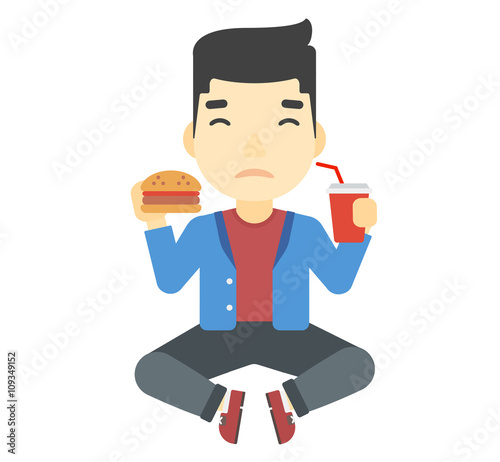 Man eating hamburger. 