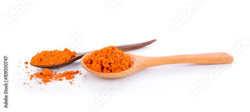 turmeric in the spoon on white background