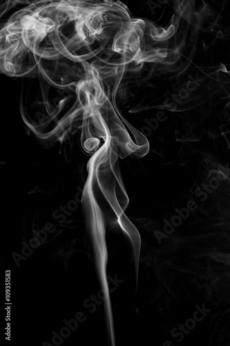 Abstract gray smoke from the incense sticks.