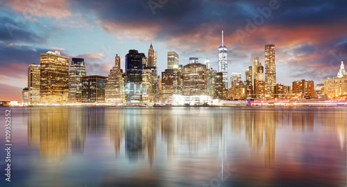 New York city skyline at sunrise with reflection.