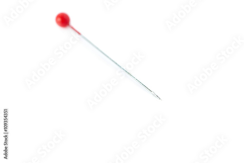 Small needle isolated over the white background