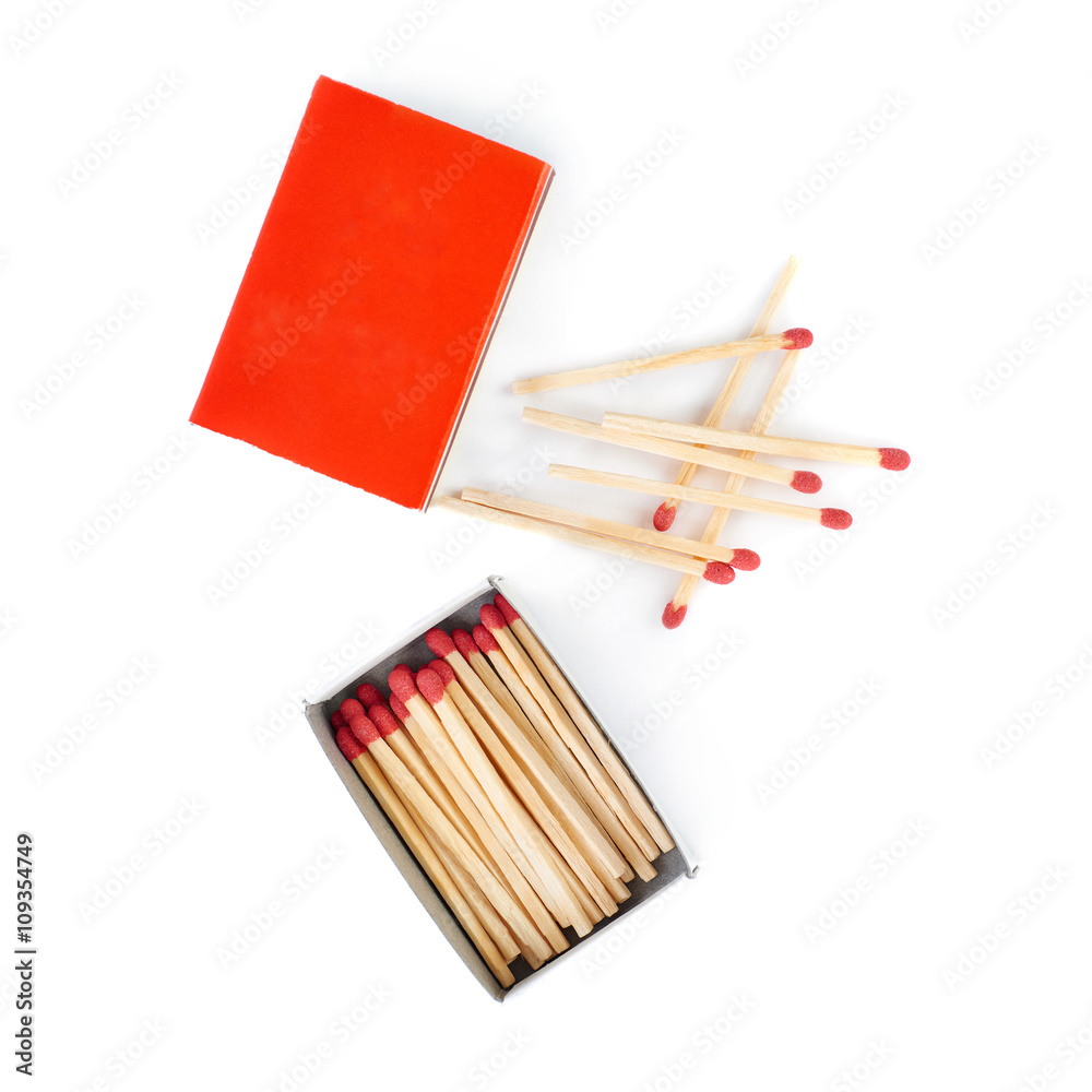 Pile of Wooden matches with box isolated over the white background Pile of Wooden matches with box isolated over the white background