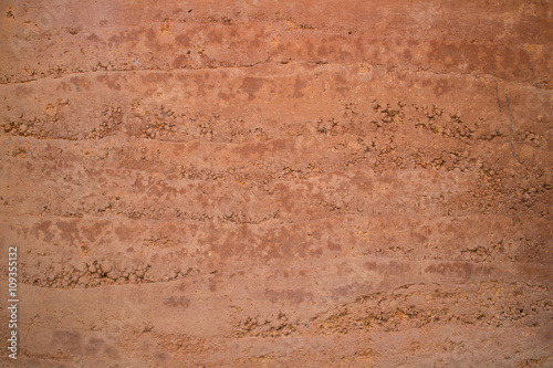 Fotografija red soil wall texture. background