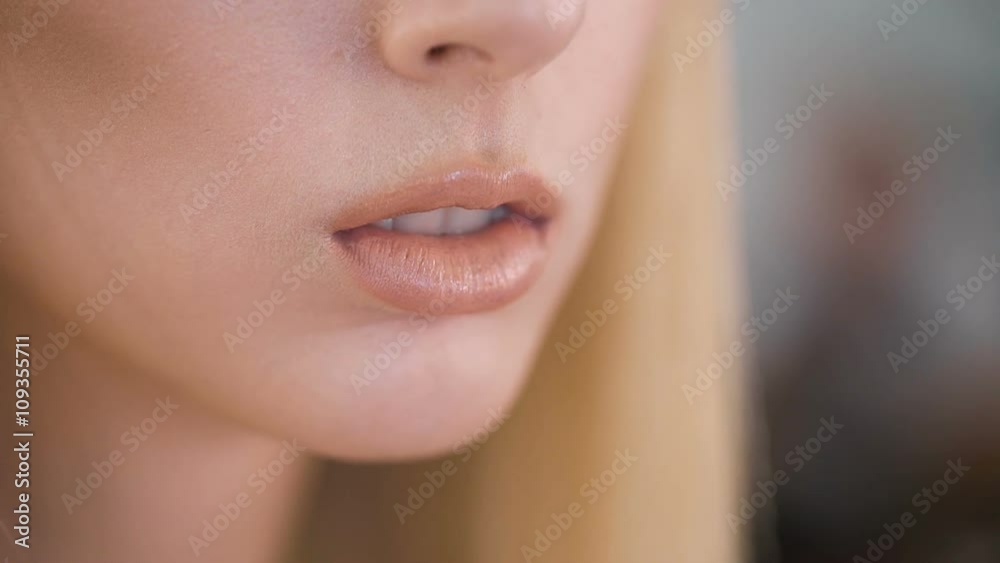 Exciting sex symbol. Slightly parted lips of a beautiful young girl. It represents chyvstvennost and tenderness.  Stock-video | Adobe Stock