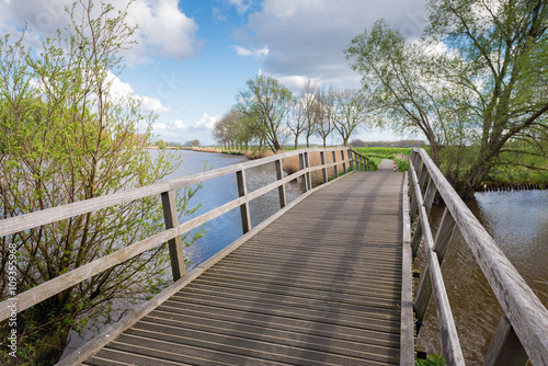 Wooden bridge on a sunny day in springtime