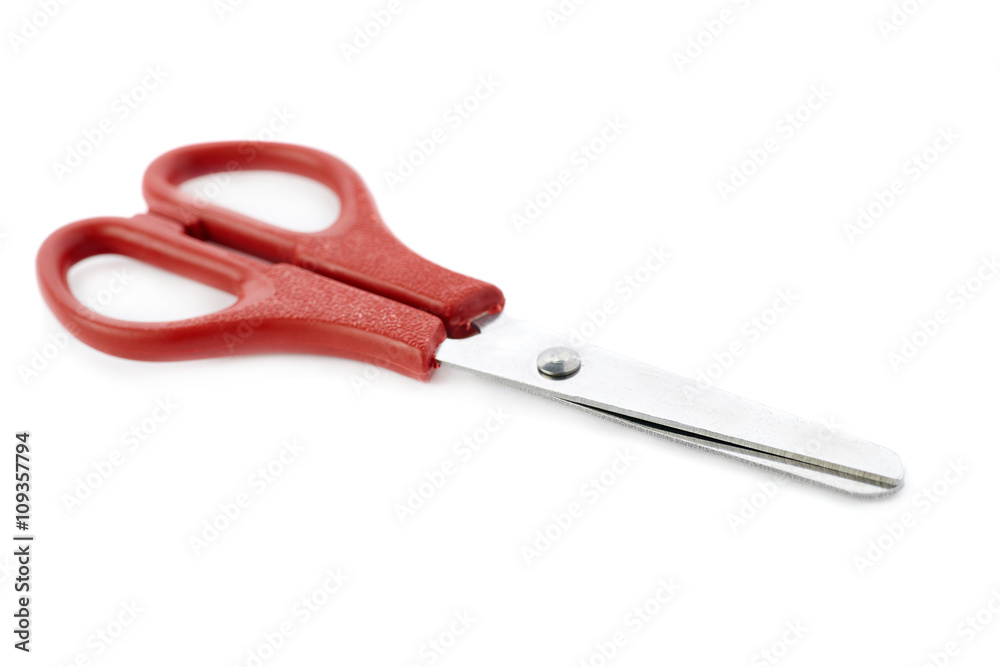 Red scissors isolated over the white background Red scissors isolated over the white background
