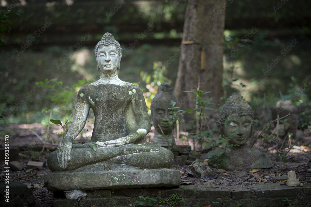 Damaged Buddha statue Thailand.