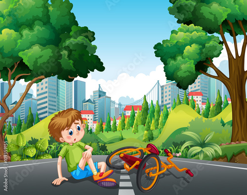 Boy falling off the bike on the street