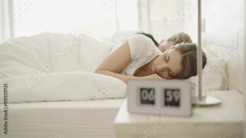 Wallpaper Mural 4k footage, alarm clock ringing in the morning, young woman waking up, stretching
 Torontodigital.ca