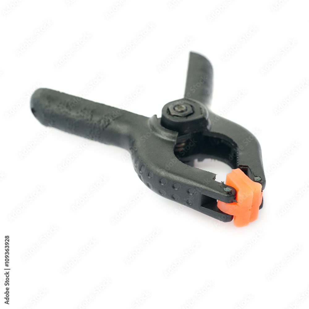 Clamp with orange plastic jaws, isolated over the white background Clamp with orange plastic jaws, isolated over the white background