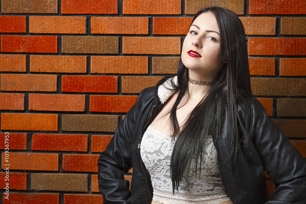 Hot girl against brick wall Hot girl against brick wall
