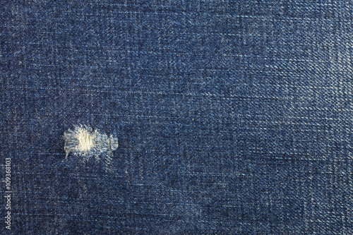 Blue torn denim jeans texture, Jeans background.