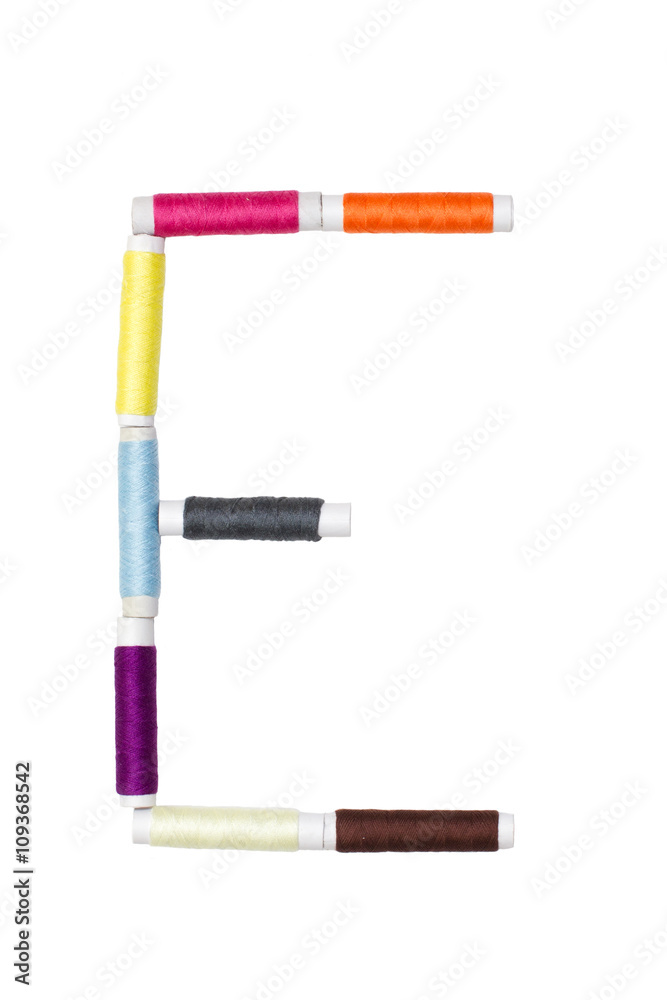 E letter made of spool sewing thread E letter made of spool sewing thread