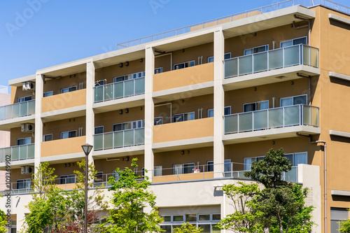 Schilderij op canvas Apartment building in Japan, against blue sky