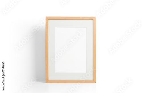 Wooden picture frame on white desk