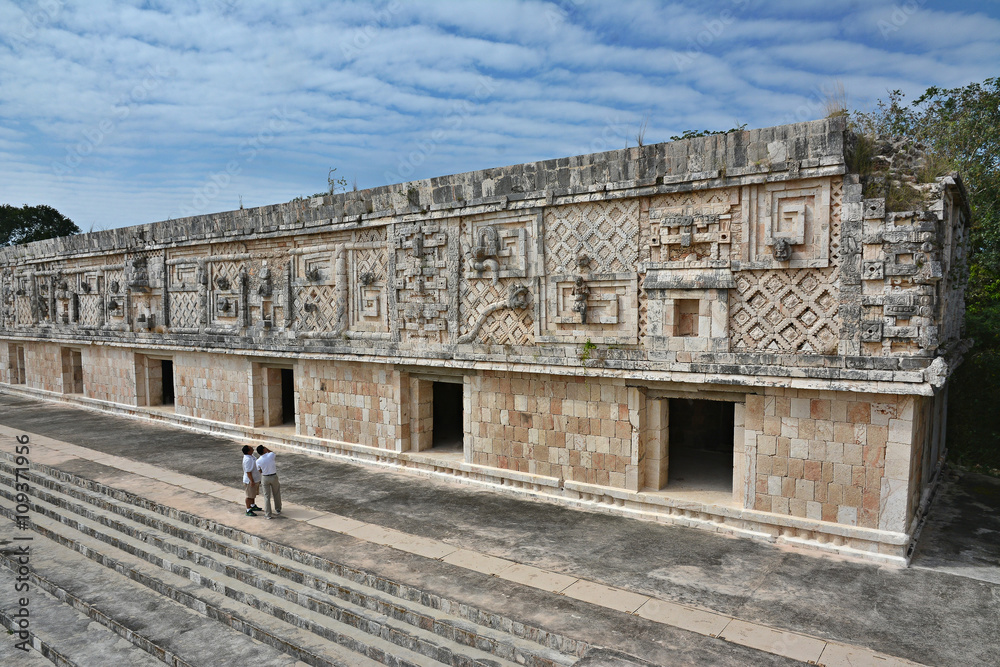 People viewing of the nunnery building in Uxmal. Yucatan Peninsu