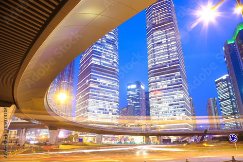 The highway bridge car light trails of shanghai modern urban bui