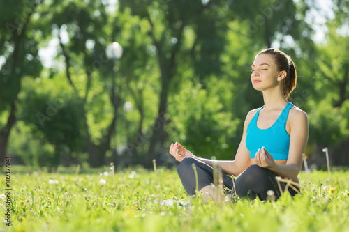 Woman meditating in park