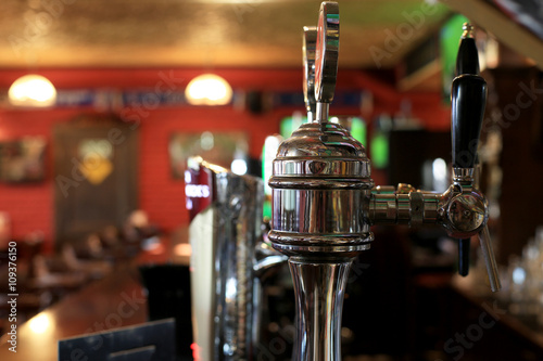 Chrome beer taps with highlights in the pub