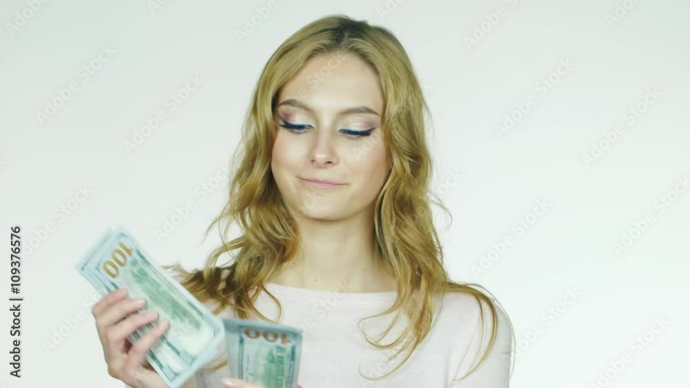 Attractive woman shows a fan of money concept - you can win Attractive woman shows a fan of money concept - you can win