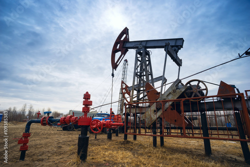 Pump-rocking chair at an oil field in the spring.