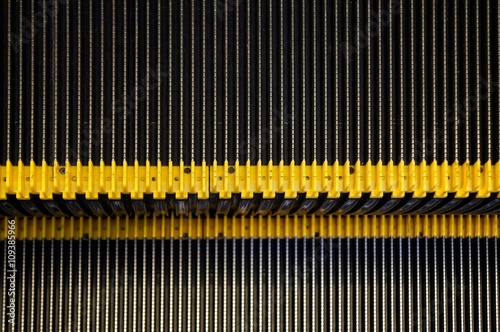 Abstract background texture of striped pattern of metal escalator foot step